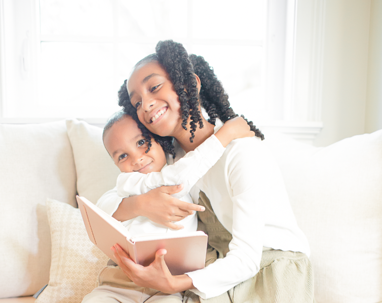 Children Reading A Book Together