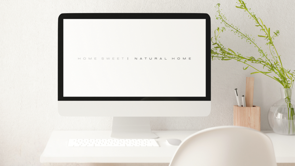 Computer with Home Sweet Natural Home Text Logo on the screen